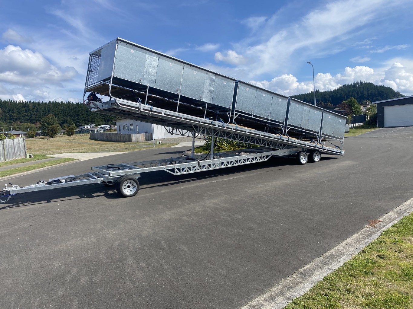Very long custom manufactured trailer with three axles and tipper